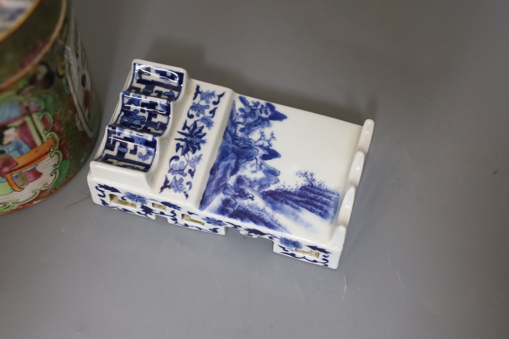 A Chinese Canton famille rose jar and cover and a Chinese blue and white brush stand